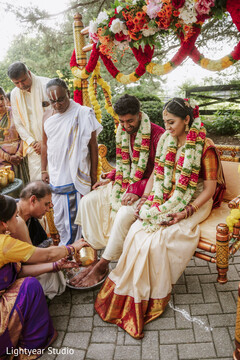 Couple in traditional attire with floral garlands