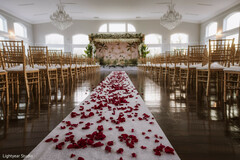 Elegant Ceremony Decor with Floral Arch and Rose Petal Aisle