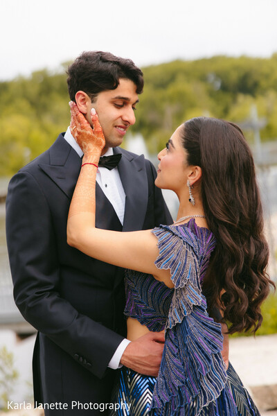 couple portraits,reception attire,tuxedo,evening gown,romantic embrace,outdoor portraits,wedding reception,candid romance,elegant fashion,south asian wedding