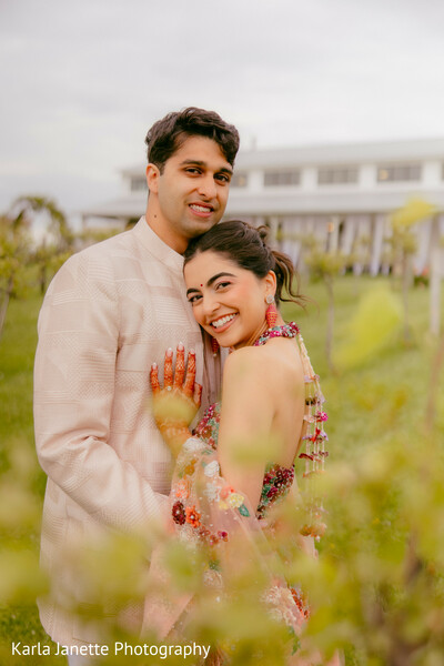 couple portraits,vineyard,pre wedding,romantic embrace,colorful attire,outdoor portraits,love story,candid smiles,south asian couple,wedding festivities