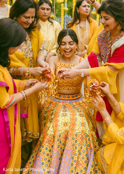 haldi ceremony,kaleere,family traditions,bride,pre wedding rituals,candid laughter,yellow outfits,wedding celebrations,indian traditions,south asian wedding
