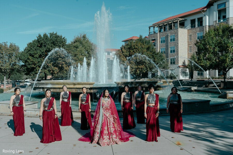 bridesmaids,bridal party,group portraits,fountain backdrop,burgundy dresses,bridal lehenga,wedding party,outdoor portraits,bridal squad,south asian wedding