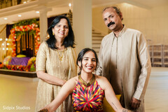 Vibrant Family Portrait: Colorful Halter-Neck Top & Detailed Henna