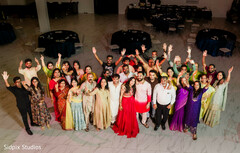 Vibrant Group Portrait with Raised Arms