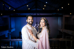Couple in Pink and White Attire with String Lights