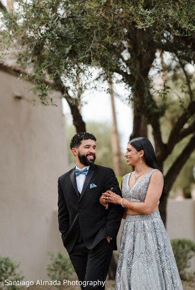 south asian wedding,couple portrait,silver lehenga,black suit,light blue bow tie,outdoor photo session,wedding fashion,elegant attire,pre-wedding fashion