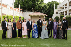 Family Poses on Lush Green Lawn