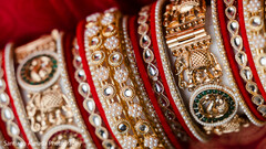 Intricate Gold Bridal Bangles Adorned with Red Fabric