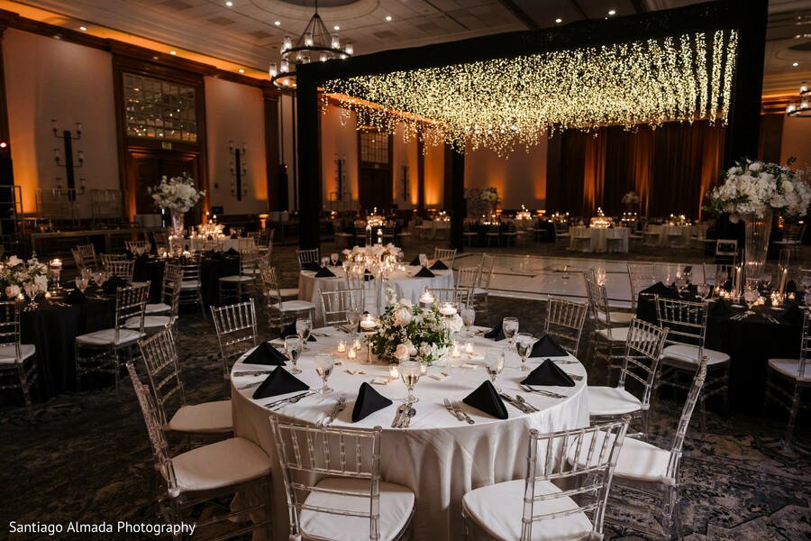 reception decor,elegant reception,floral ceiling,wedding lighting,wedding tables,event design,luxury wedding,floral arrangements