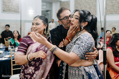 Father's Affectionate Kiss for Daughter at South Asian Celebration