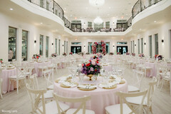 Elegant Ballroom Reception with Light Pink Linens and Purple and Pink Floral Centerpieces