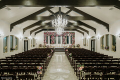 Indoor Ceremony with Floral Wall and Chandelier