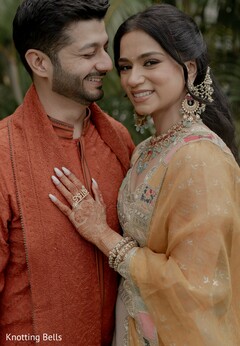 Couple in Rust Kurta and Ornate Bridal Earrings