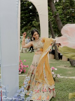 Bride in Floral Lehenga with Golden Dupatta