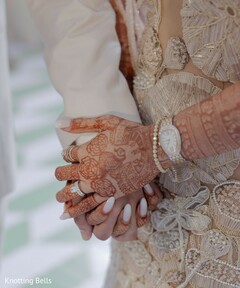 Bridal Hands Adorned with Intricate Mehndi and a Diamond Ring