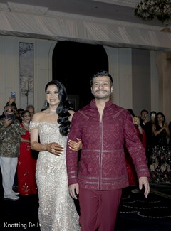 Couple Walks Together in Elegant Reception Attire