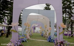 Pastel Archway Wedding Entrance with Floral Accents