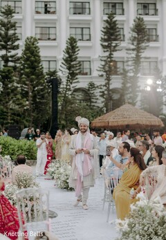 Groom's Entrance on a Floral-Lined Path