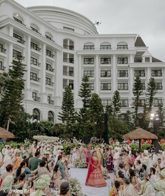 Grand Outdoor Ceremony Entrance with Red Lehenga Bride