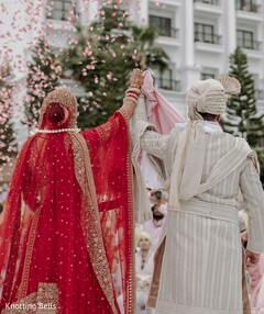 Couple Under Falling Petals
