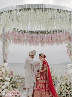 Couple Under a Mandap with Cascading Florals
