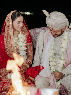 Bride and Groom Seated by Fire During Ceremony