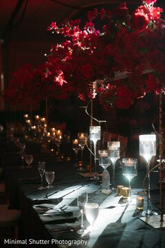Dramatic Red Floral Centerpieces on a Dark Reception Table Setting