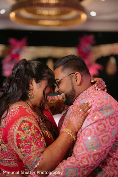 Couple Embraces in Embroidered Outfits