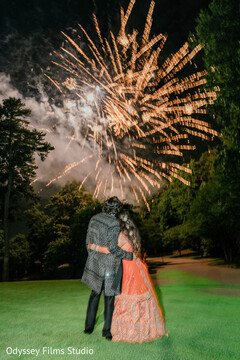 Couple Embraces Under Dazzling Fireworks Display