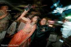 Joyful Sangeet Dance Floor with Vibrant Lighting