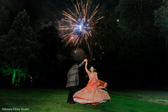 Couple Dances Under Fireworks Display