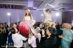 Couple Carried by Guests in Festive Reception Entrance