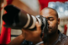 Photographer with Large Lens