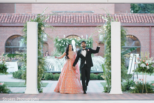 couple,wedding fashion,peach lehenga,black suit,wedding attire