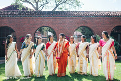 Bride in Orange Saree with Bridesmaids in Kerala Kasavu Sarees