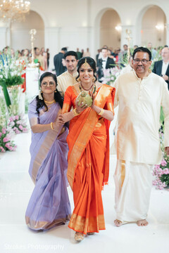 Bride in Orange Saree Walks with Attendants