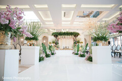 Elegant Wedding Ceremony Decor with Pink and Green Floral Arrangements