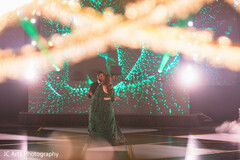 Couple on Stage with Green LED Screen and Smoke