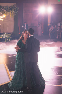 Emerald Green Gown Twirls on a Smoky Dance Floor