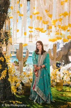 Bride in Turquoise Lehenga with Yellow and White Floral Decor