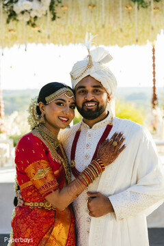 Radiant Couple in Red Sari and White Sherwani