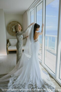 Bride's Elegant Gown with Lace Train by a Window