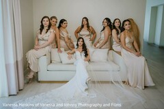 Bride in White Gown with Bridal Party in Champagne Dresses on White Sofa