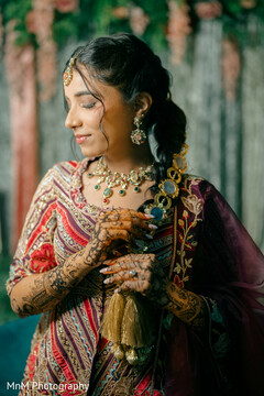 Bride's Intricate Mehndi and Embellished Jewelry