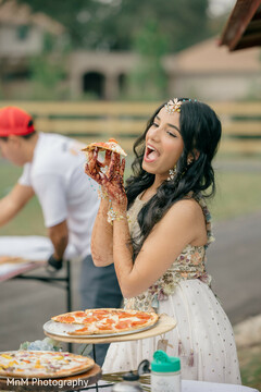 Bride Enjoys Pizza Outdoors