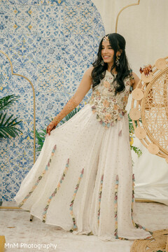 Bride in White Lehenga with Floral Top and Tassel Details
