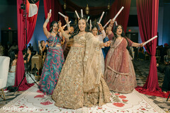 Bride Dances with Women During Celebration
