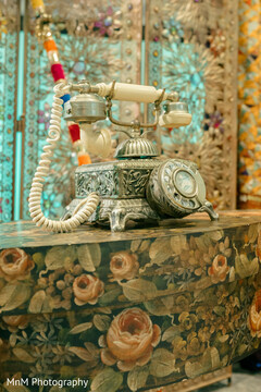 Ornate Rotary Phone on Hand-Painted Floral Chest