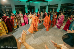 Women Dance in a Circle During a Celebration