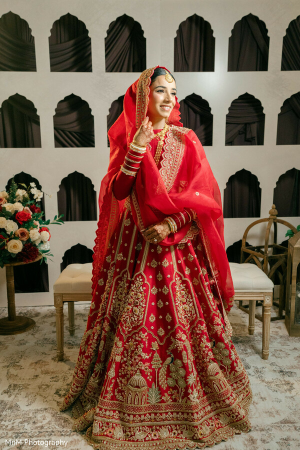 Bride in Red Lehenga with Gold Embroidery and Choker